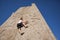 Climber free climbing a wall