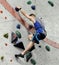 Climber on grey wall top-rope