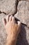 Climber Hand Grabbing Rock