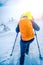 Climber hiking to a snowy hill during a winter holidays