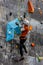 Climber with ice axes climbing on artificial ice climbing and dry tooling wall on the Dry Tool World Cup in Brno