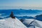 Climber on a knife edge snow mountain ridge