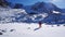 A climber looks at the entrance to an ice cave.