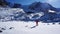 A climber looks at the entrance to an ice cave.