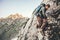 Climber Man climbing rocky mountains