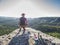 Climber man sit on rock, prepare for eating snack during rest