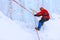 Climber moves traverse the ice wall