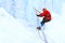 Climber moves traverse the ice wall