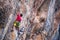 Climber overcomes a difficult climbing route on a natural terrain