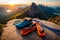 A climber\\\'s gear laid out on a rocky ledge, including carabiners, ropes, and quickdraws, ready for the ascent