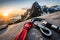 A climber\\\'s gear laid out on a rocky ledge, including carabiners, ropes, and quickdraws, ready for the ascent