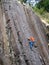 A climber scales The Columns basalt cliff in Eugene, Oregon