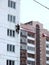 Climber spends repair work on a multi-storey building height