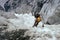 Climber on steep ice couloir