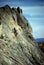 Climber on steep rock face