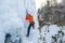 Climber swinging the ice axes