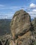 Climber on top of massive rock