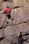 Climber up wall with belayer