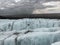 A climber walking across icelandic glaciers