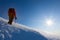 Climber walks on a glacier. Winter season, clear sky.