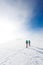 climbers climb the mountain in the snow. Winter mountaineering. two girls in snowshoes walk through the snow. mountaineering