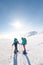 climbers climb the mountain in the snow. Winter mountaineering. two girls in snowshoes walk through the snow. mountaineering