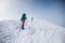 climbers climb the mountain. Winter mountaineering. two girls in snowshoes walk through the snow