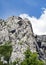 Climbers are climbing a rocky mountain in Paklenica, Croatia