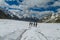 Climbers on glacier traver mountain route attached to the alpinist rope