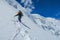 Climbers on glacier traver mountain route attached to the alpinist rope