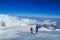 Climbers on glacier traver mountain route attached to the alpinist rope