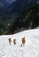 Climbers on steep snow