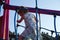 Climbing activities on the children playground. A little girl on a playground