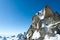 Climbing in Chamonix. Climber on the snowy ridge of Aiguille du