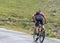 Climbing the Gavia pass by mountain bike while it is raining.