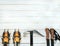 Climbing gear on white wooden background, top view