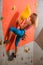 Climbing Gym. Young Woman Climber Bouldering. Extreme Sport and Indoor Climbing Concept