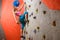 Climbing Gym. Young Woman Climber Bouldering. Extreme Sport and Indoor Climbing Concept