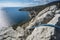 Climbing rope on top mountain with the view over village of Katsiveli. Crimea