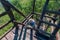 Climbing up by wooden steps in the natural observation tower