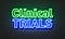 Clinical trials neon sign on brick wall background.