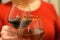 Clink wine glasses in hands holiday