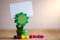 Clip holder card stand green sunflower shaped and multicolored paper stars.