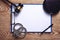 Clipboard, handcuffs, pen with judge gavel on wooden background