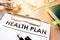 Clipboard with health plan.