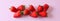 Clipped to banner size image of Strawberries isolated on a pink background