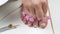 Clippers tweezers hair on the toes.Pink dividers fingers.Pedicures and skin care