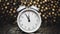 A clock on a bokeh background. Happy New Year concept. Plans and dreams. Holiday. Countdown of the new time