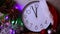 Clock counting last moments before Christmas or New Year. White alarm clock with the time 23.55 am. Countdown to midnight
