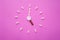 Clock created from white pills and brown tablets on pink background. Right time for using medicines